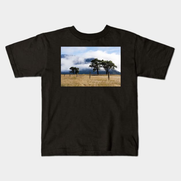 clouds and trees Kids T-Shirt by sma1050